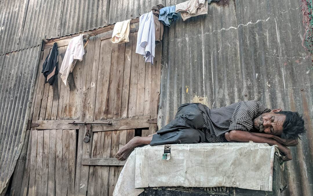 Man sleeping outside the building